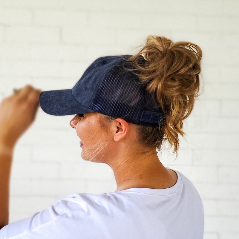 low bun with baseball cap