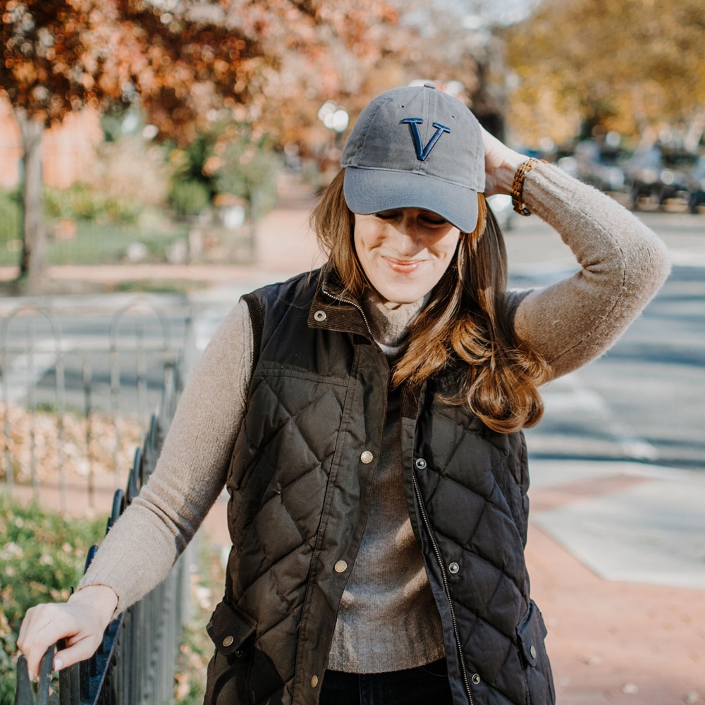 wearing a baseball cap