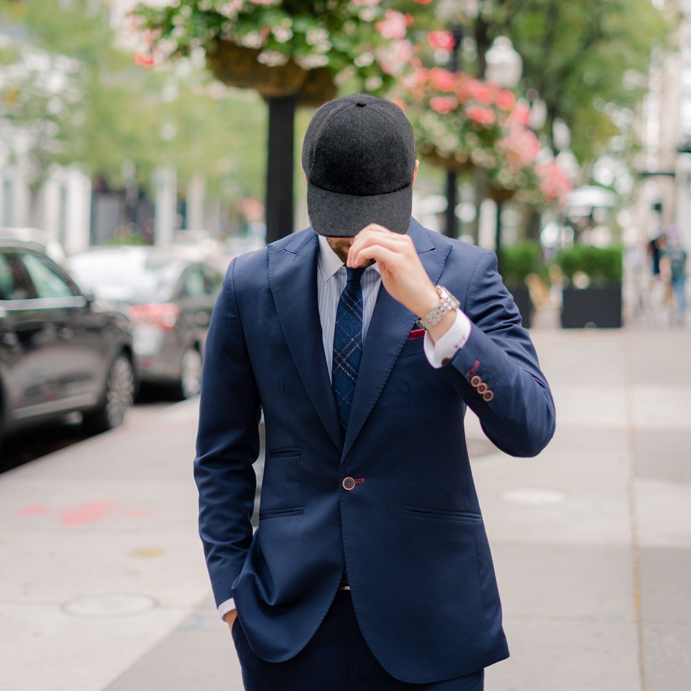 suit with baseball cap