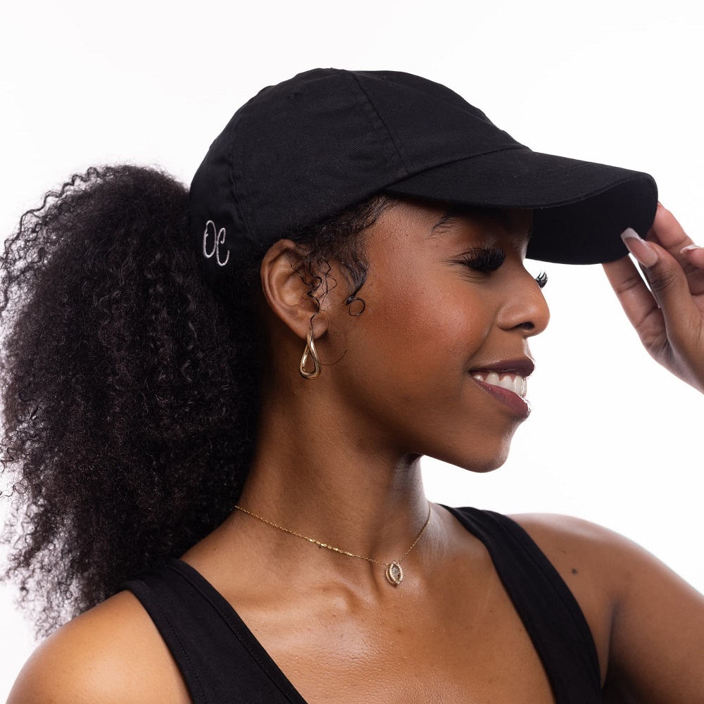 curly hair with baseball cap