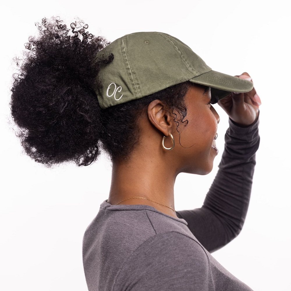 curly hair with baseball cap