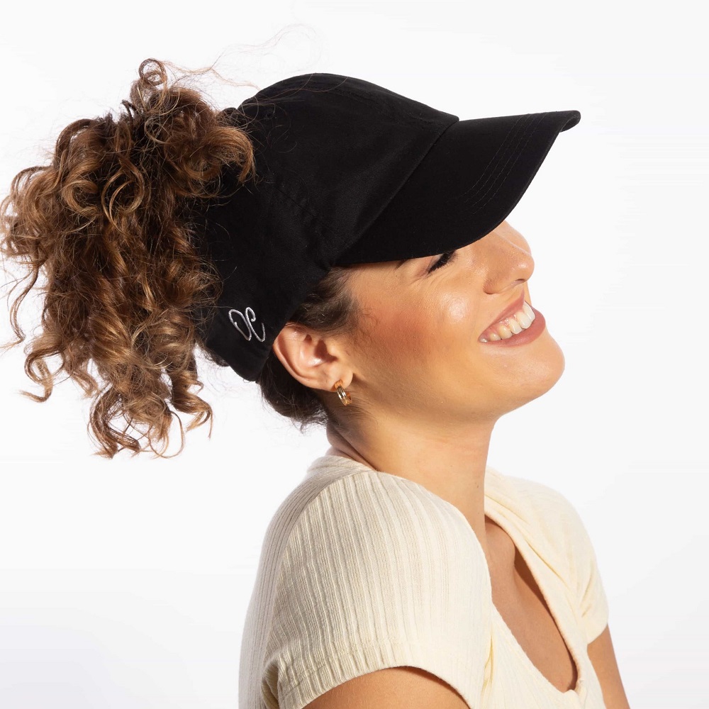 curly hair with baseball cap