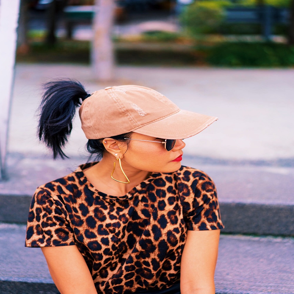 girl wearing baseball cap